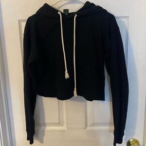 Cropped black sweatshirt.